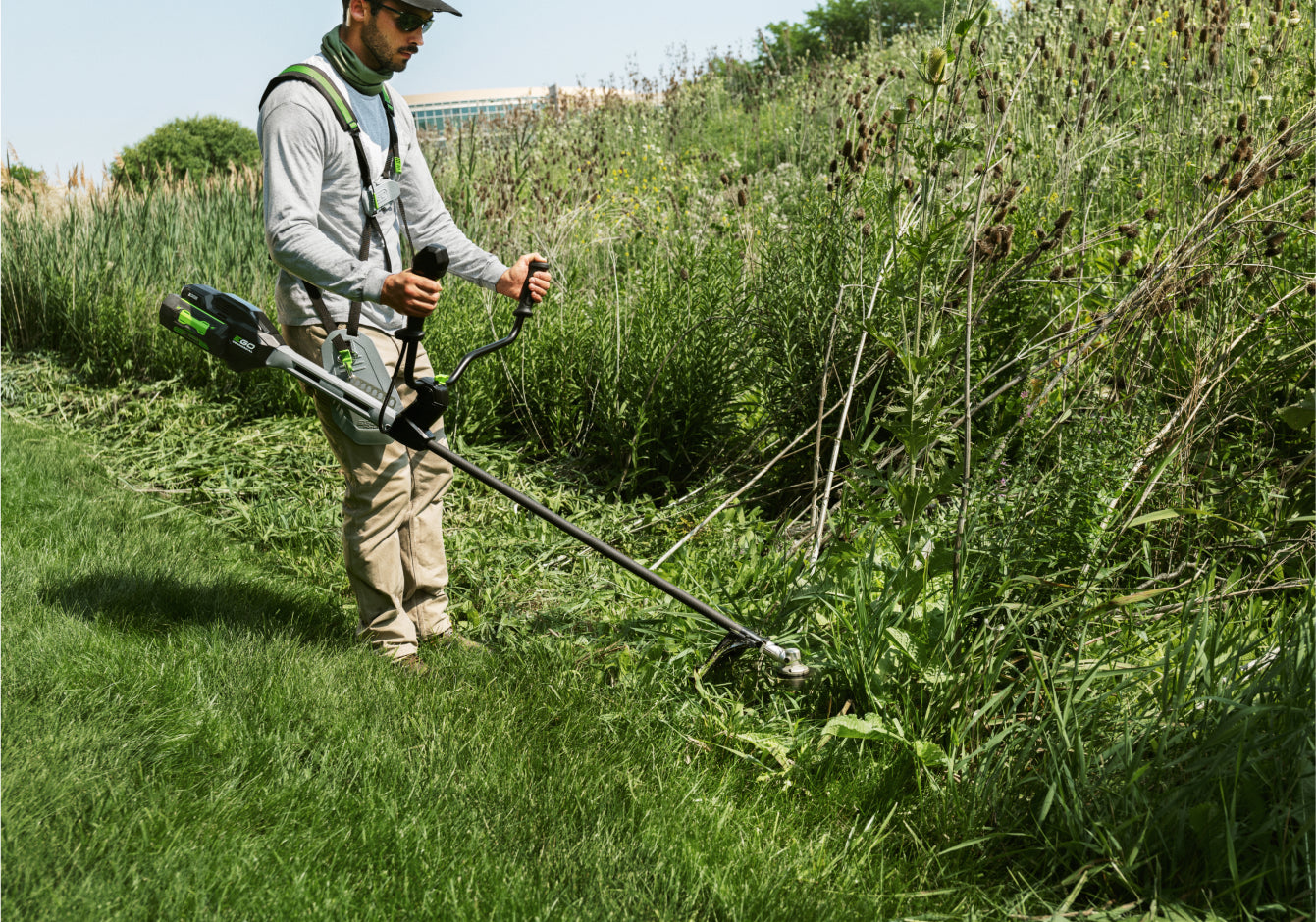 EGO Commercial Bike Handle Brush Cutter in use