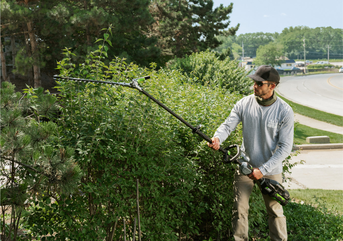 EGO Commercial 21” Articulating Pole Hedge Trimmer in use 