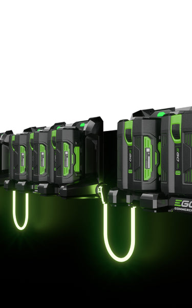 Interconnected 3-Port Docks with glowing cords, each charging three EGO 56V ARC Lithium batteries